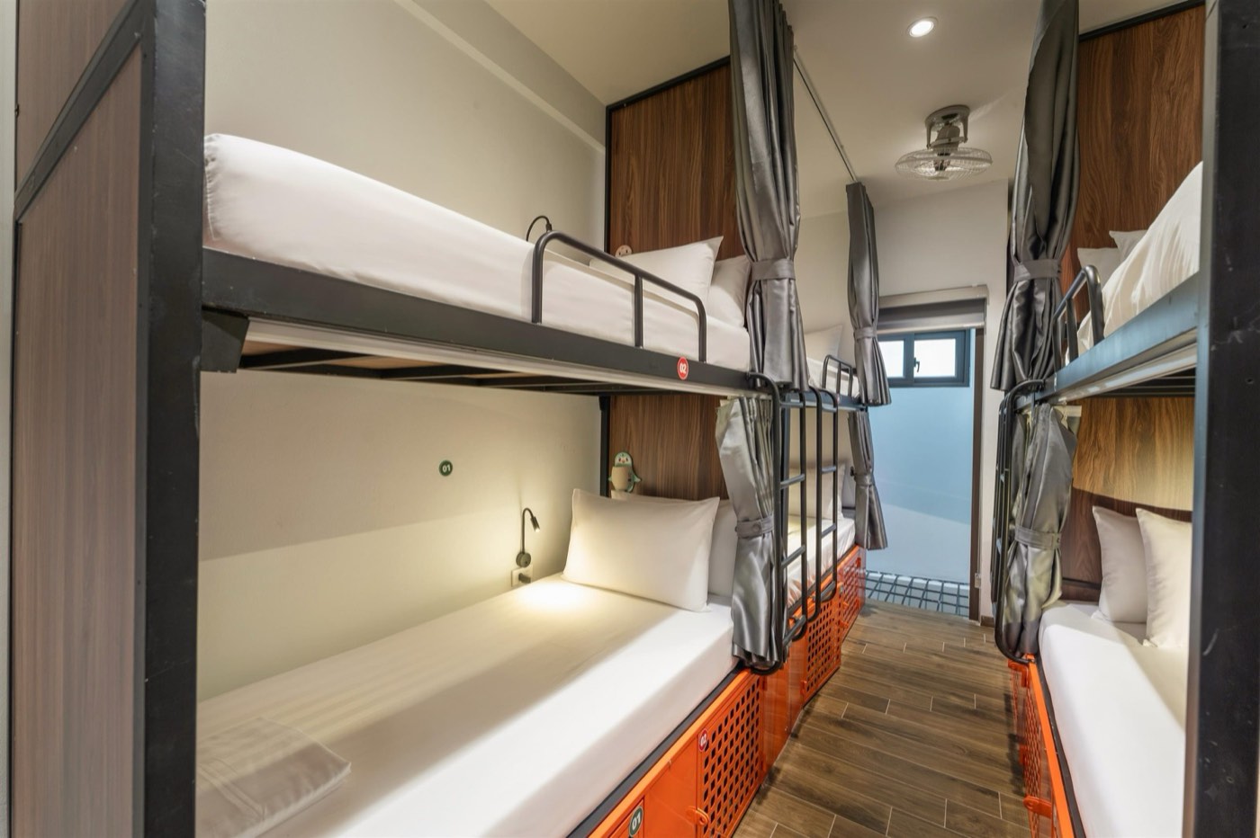 Bunk with reading light and curtain, photo from floor 3, same layout