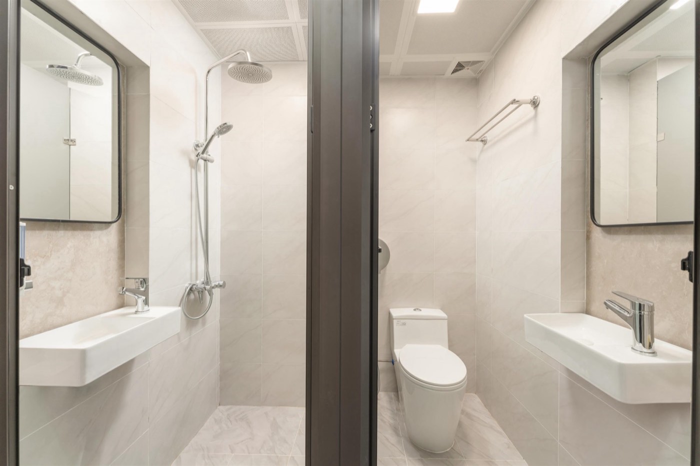 Clean shared bathroom with rain shower