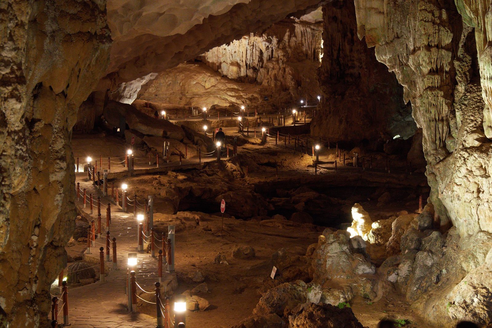 The lit walkway through the great chamber of Surprise Cave (Sửng Sốt)