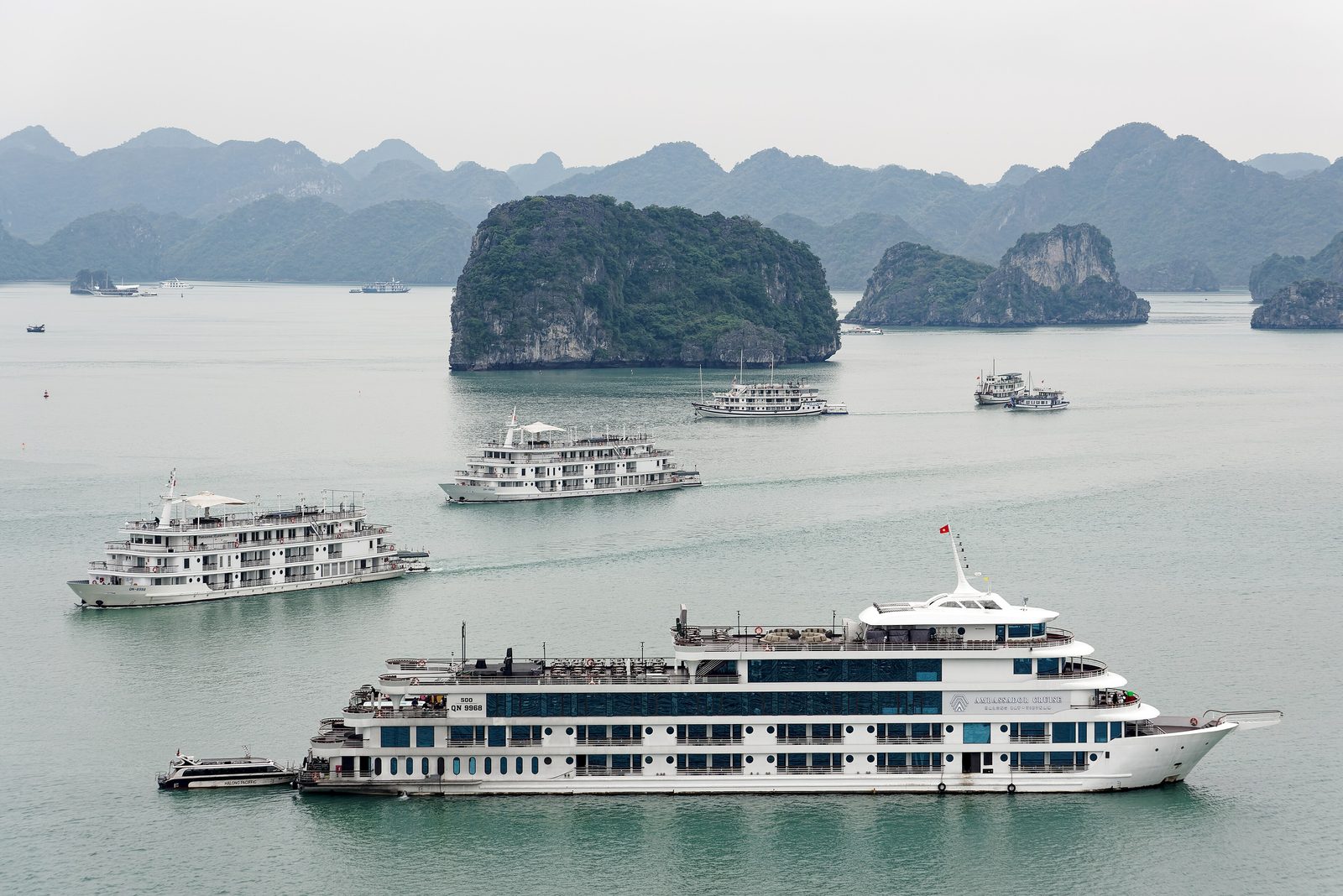 Cruise boats among the karst islands, seen from Ti Tốp